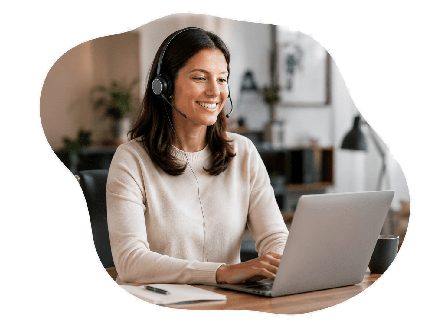 WorldSchoolFinder support team member wearing a headset at a laptop